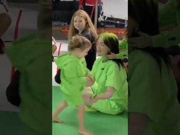 Billie Eilish playing with a little kidshorts