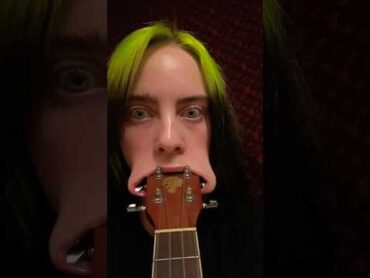 Billie Eilish fits entire ukulele head in her mouth … TWICE 😂 shorts billieeilish